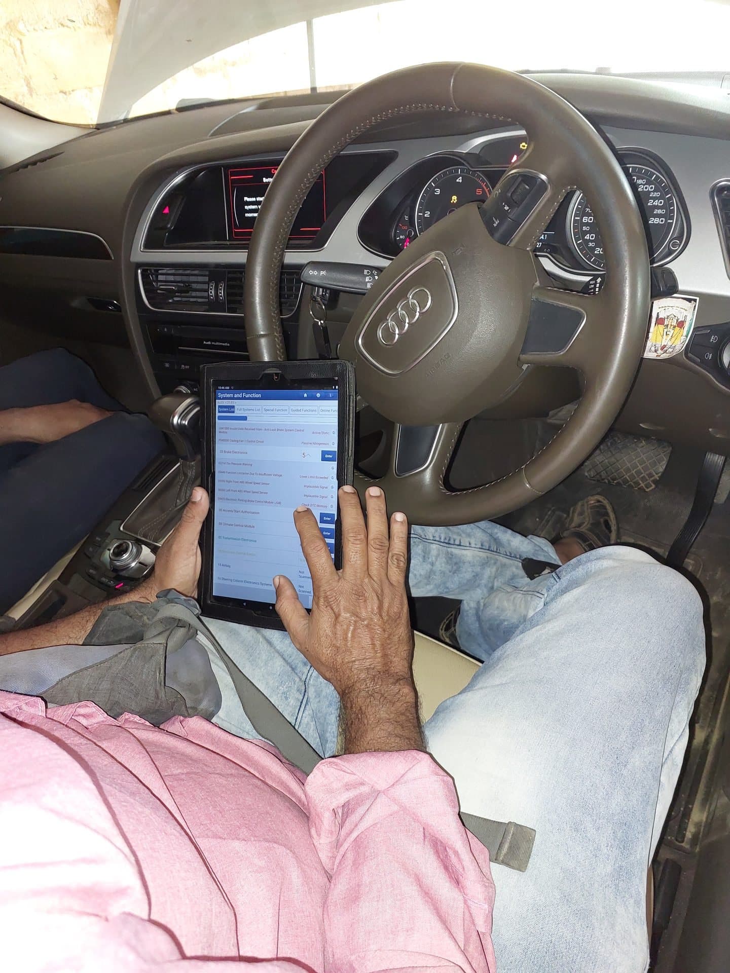 Computer diagnostic scan inside an Audi at Qaswa Car Garage