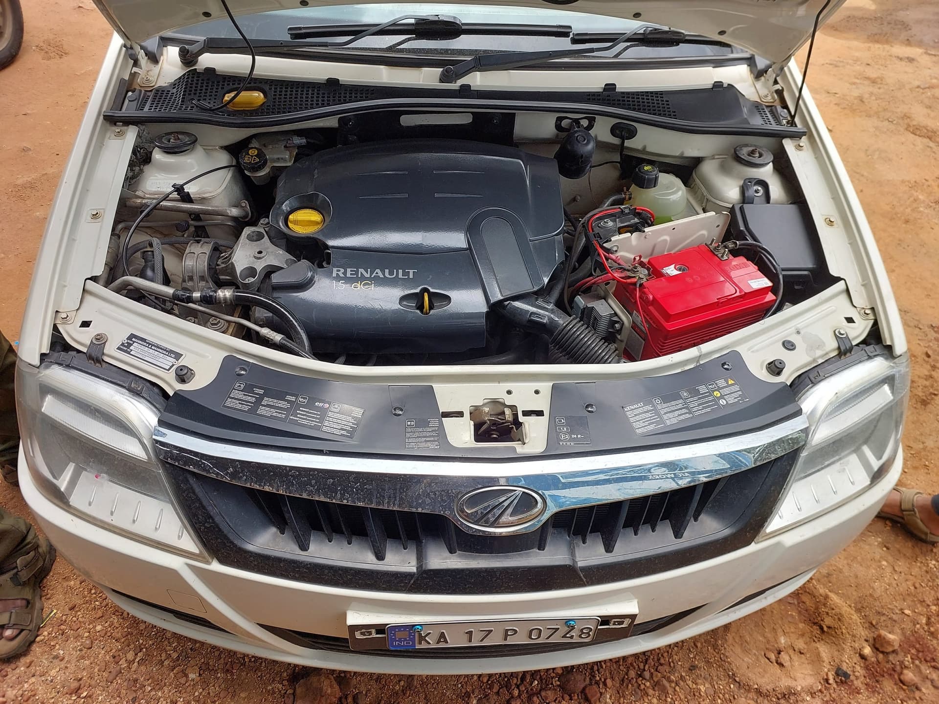 Open engine bay showing battery and electrical components