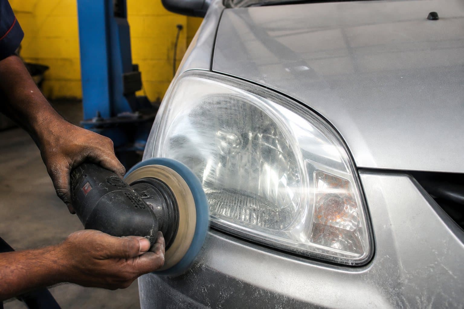 Headlight buffing on a car lamp at Qaswa Car Garage