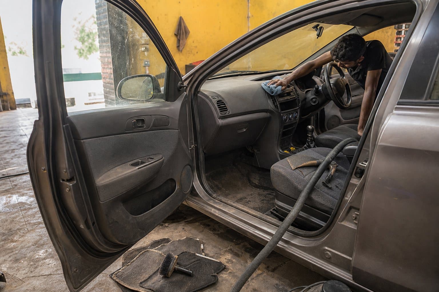 Interior cleaning of a car cabin at Qaswa Car Garage